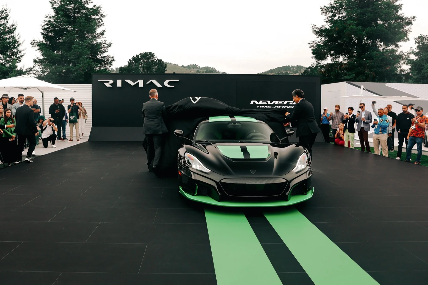 Hypercar unveiling on an outdoor show floor